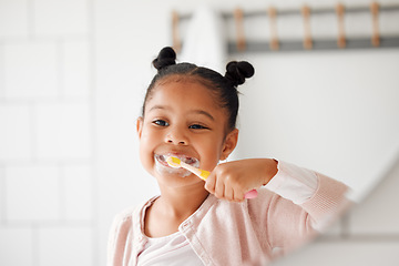 Image showing Toothbrush, brushing teeth and child in a home bathroom for dental health and wellness. Face of african girl kid cleaning mouth with a brush in a mirror for morning routine and oral self care