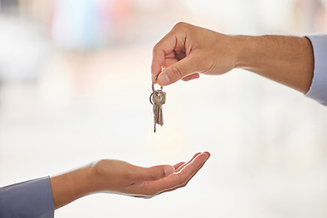 Image showing Hands, realtor and agent giving keys to customer after moving into new home. Property, real estate and handing over key to owner for sale, loan or mortgage investment in apartment, house and mockup.