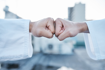 Image showing Motivation, support and fist bump for karate in the city for fitness, training or learning. Deal, goal and together hands of people in creative sports or martial arts with power and urban competition