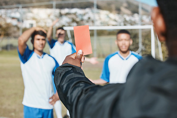 Image showing Sports team, red card and soccer referee outdoor on field for game foul, mistake or compliance. Football player, athlete club and paper in person hand for sport warning, penalty rules or dismissal