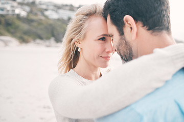 Image showing Beach, love and couple touching face on holiday, vacation and romantic weekend for anniversary. Intimacy, marriage and happy mature man hugging woman for bonding, quality time and happiness by ocean