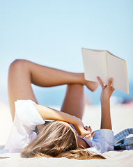 Image showing Beach, book and person reading on vacation, holiday or summer travel in nature outdoor with mockup space. Relax, novel and woman at sea or ocean coast for calm, peace and freedom for break in Bali.