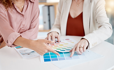 Image showing Hands, color pallet and business women in a meeting for design, decision and choice discussion. Fingers, closeup and female designer team with different shades on paper, creative and collaboration