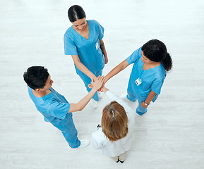 Image showing Above, teamwork or hands of doctors in stack in meeting collaboration for healthcare targets or goals. About us, team building or top view of medical nurses with group support, motivation or mission