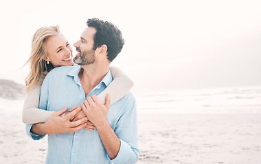 Image showing Travel, happy and couple hug at beach for holiday, vacation and romantic weekend for anniversary. Love mockup, marriage and mature man hugging woman for bonding and happiness by ocean with space