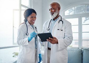 Image showing African doctors, teamwork and smile with tablet, comic or conversation for team building in hospital. Senior black man, woman and medical discussion with digital touchscreen, social media and clinic