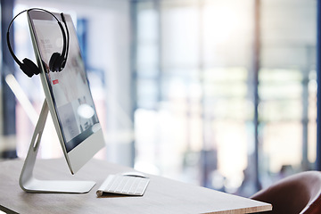 Image showing Call center, headset and desk with computer in office for consulting, crm and technology communication or help. Workplace, customer service or telemarketing pc on desktop for work, agency or support