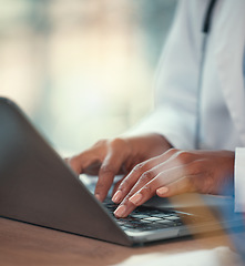 Image showing Hands, laptop and research with a doctor in the hospital, typing healthcare data for diagnosis in an office. Computer, insurance and report with a medicine professional searching medical information