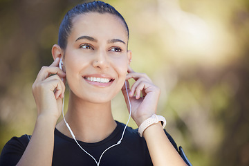 Image showing Earphones, runner or happy woman streaming music to start training, workout or running exercise in park. Smile, thinking or healthy sports girl athlete listening to radio or podcast about fitness