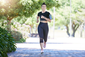 Image showing Phone, fitness or happy woman running in park training, cardio exercise or full body workout for marathon. Wellness, athlete runner smiling or healthy sports girl exercising on jog outdoors in nature