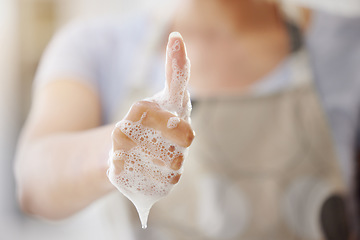 Image showing Closeup, soap and person with thumbs up, foam and hygiene with healthy habits, agreement and wellness. Zoom, woman and girl with hand gesture, promotion or daily care with bacteria, clean and bubbles