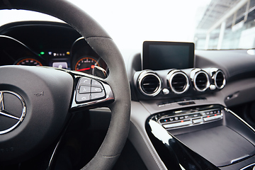 Image showing Control buttons on steering wheel. Car interior.