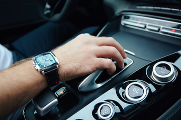 Image showing hand on automatic gear shift, Man hand shifting an automatic car