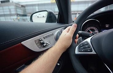 Image showing Man sitting and driving in the car.