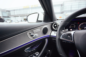 Image showing Control buttons on steering wheel. Car interior.