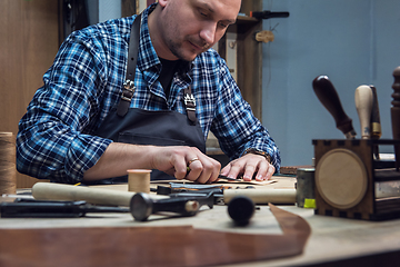 Image showing Concept of handmade craft production of leather goods.