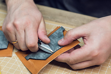 Image showing Concept of handmade craft production of leather goods.