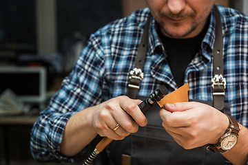 Image showing Concept of handmade craft production of leather goods.