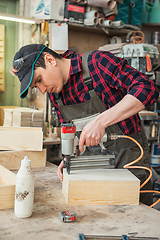 Image showing Worker making the wood box