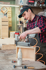 Image showing Worker making the wood box