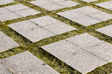 Image showing old large tiles on the road