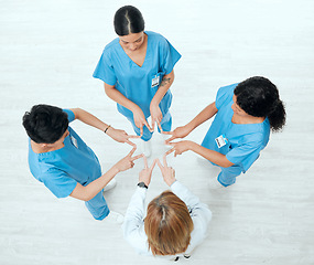 Image showing Above, star or hands of doctors in hospital with teamwork in nurses collaboration for healthcare goal. About us, team building or top view of medical group with support shape, motivation or mission