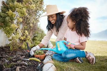 Image showing Gardening, mother and child water a plant in backyard learning environmental, organic and nature skills. Landscaping, family and happy girl with mom watering and planting sprout in soil for growth