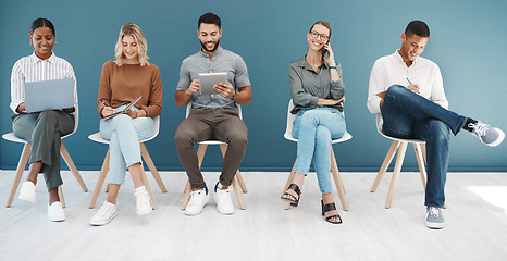 Image showing Group, business people and tech by wall for interview with smile, diversity and waiting room for hr recruitment. Men, women and together for networking, human resources and hiring for job at startup