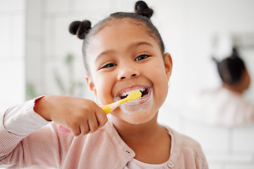 Image showing Toothbrush, brushing teeth and face of a child in a home bathroom for dental health and wellness. Smile portrait of african girl kid cleaning mouth with a brush for morning routine and oral self care