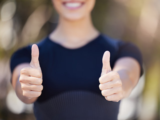 Image showing Runner, hands or woman with thumbs up in park for fitness training with positive mindset or smile. Workout motivation, blur closeup or girl smiling with like sign, hand gesture or thumb up in nature