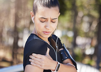 Image showing Shoulder pain, runner or woman with injury, joint or bad body ache in fitness training or workout. Tension in bruised arms, sore muscles or injured sports girl in accident, agony or emergency in park