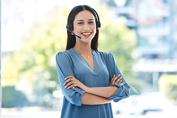 Image showing Woman with arms crossed, portrait and callcenter, contact us with customer service agent in workplace with smile. CRM, communication and tech support, female consultant for help desk and mockup space