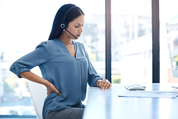 Image showing Back pain, stress and woman at a call center with posture issue while working for telemarketing in office. Spine, backache and female consultant with anxiety, joint or problem while consulting in crm