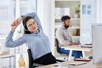 Image showing Consultant, lazy woman call center agent with stretch and tired at her desk with a computer of workplace. Online communication or telemarketing, burnout and female person stretching for fatigue