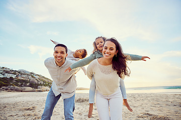 Image showing Beach, piggyback and portrait of parents and children for family holiday, summer vacation and weekend. Nature, travel and happy mom, dad and kids playing by ocean for bonding, fun and quality time