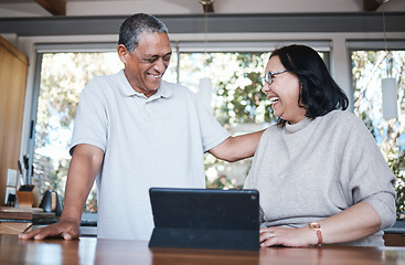 Image showing Happy, laughing and senior couple with digital tablet in a kitchen, relax and bonding in their home. smile, laugh and old people enjoying retirement, joke and fun while browsing online in their house