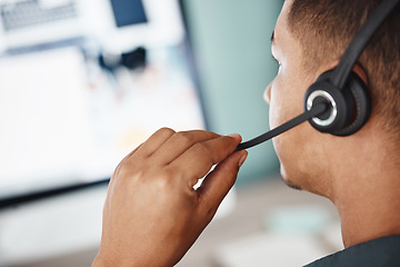 Image showing Back, call center and man listening on computer for telemarketing, customer service and support. Crm, contact us and sales agent, consultant or employee working at help desk, consulting and business.