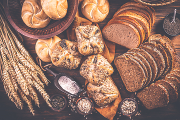 Image showing Assortment of different kind of cereal bakery - bread, pasties, buns, with healthy seeds