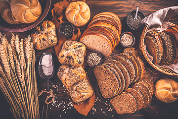 Image showing Assortment of different kind of cereal bakery - bread, pasties, buns, with healthy seeds