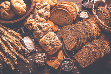 Image showing Assortment of different kind of cereal bakery - bread, pasties, buns, with healthy seeds