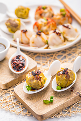 Image showing Assortment of steamed dumplings Dim Sum on kitchen table