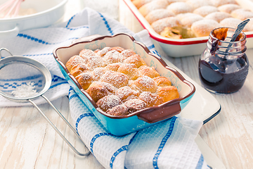 Image showing Sweet rolls, Buchteln (buchty) filled with plum jam or jelly wit