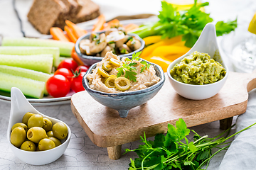 Image showing Summer crudites platter with hummus and avocado dip