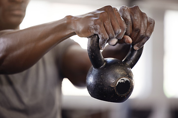 Image showing Kettlebell, hands and exercise with a man at gym for fitness, training and strong muscle growth. Athlete or bodybuilder person at club for iron weights workout for power and performance with powder