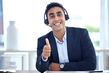 Image showing Portrait, thumbs up and business man in call center office for support, trust and success. Face, like hand gesture and happy person with excellence emoji, welcome and thank you for customer service.