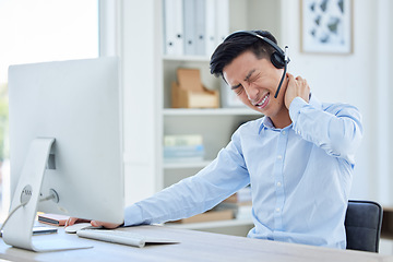 Image showing Call center, neck pain and man consulting for customer service while suffering arthritis or inflammation in office. Spine, headache and asian male consultant with posture issue while working for crm