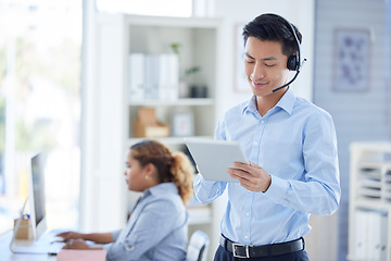 Image showing Call center, tablet and search with asian man in office for consulting, customer service and contact us. Communication, focus and help desk with male employee for technology, digital and networking