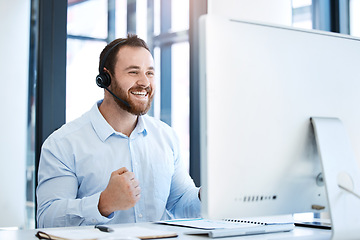 Image showing Happy man, call center and fist in celebration for winning, bonus or sales promotion at the office. Excited businessman, consultant or agent in joy for win, victory or customer service at workplace