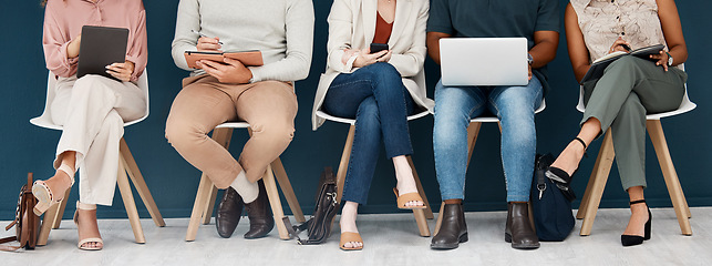 Image showing Technology, diversity with group of people and sitting together. Laptop, smartphone and tablet. Social networking or media, connectivity or streaming media and colleagues with tech sit on chair