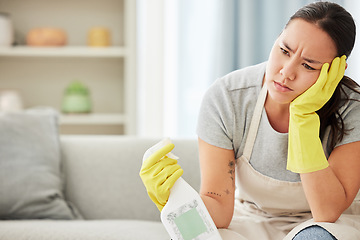 Image showing Product, maid and woman tired from cleaning furniture, counter and table in apartment living room. Housework, exhausted and frustrated worker with spray bottle to clean with products in hands